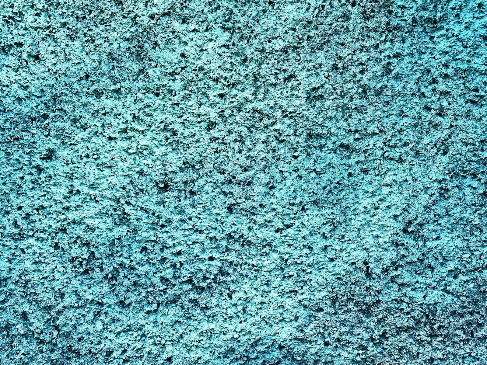 A close view of a speckled sea green ceramic glaze